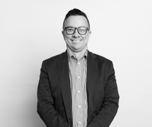 Black and white studio photo of board member Mark Jones