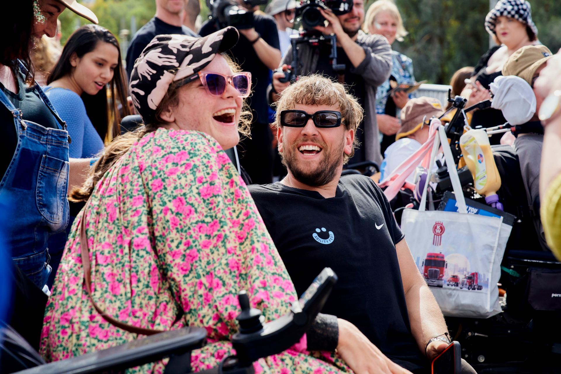 Dylan (right) laughs with female Ability Fest attendee (left) on the viewing platform.