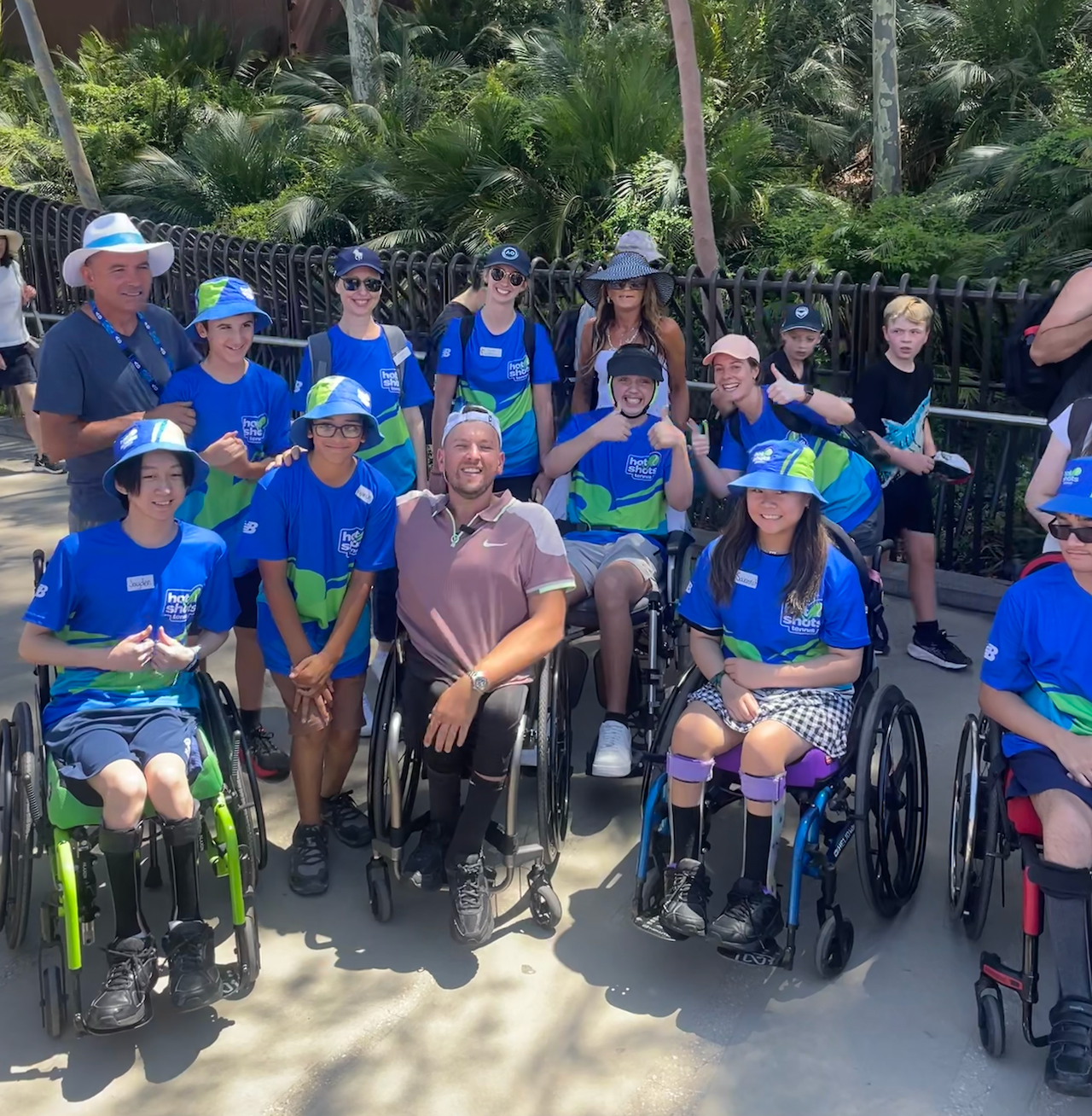 Dylan (middle) surrounded by a group of all abilities from the Royal Children's Hospital at the Australian Open.