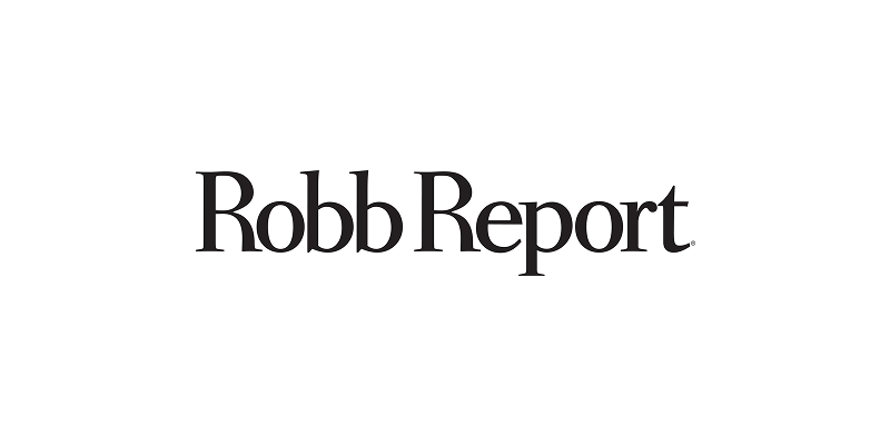 The robb report logo is black and white on a white background.