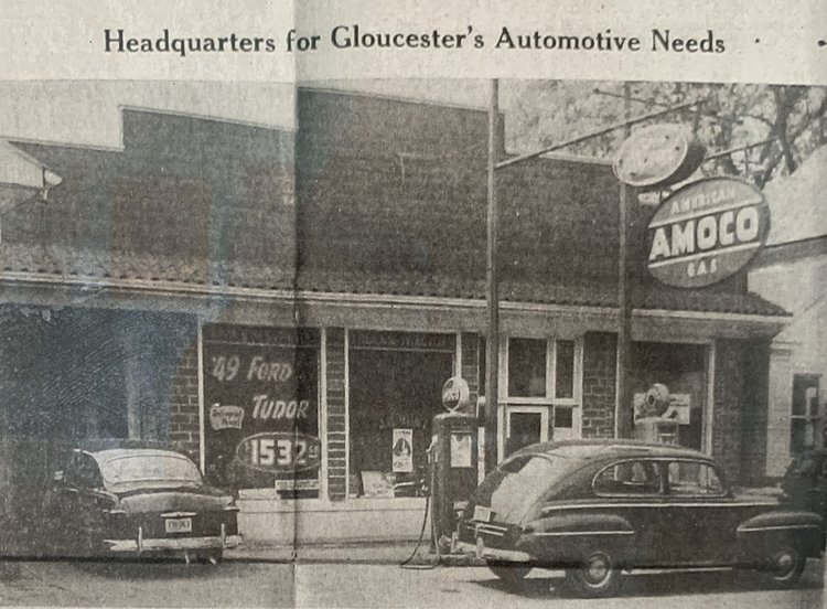 A black and white photo of an amoco gas station