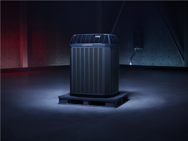 A dark background and a spotlight on the Trane® XV20i HVAC unit, the most efficient system