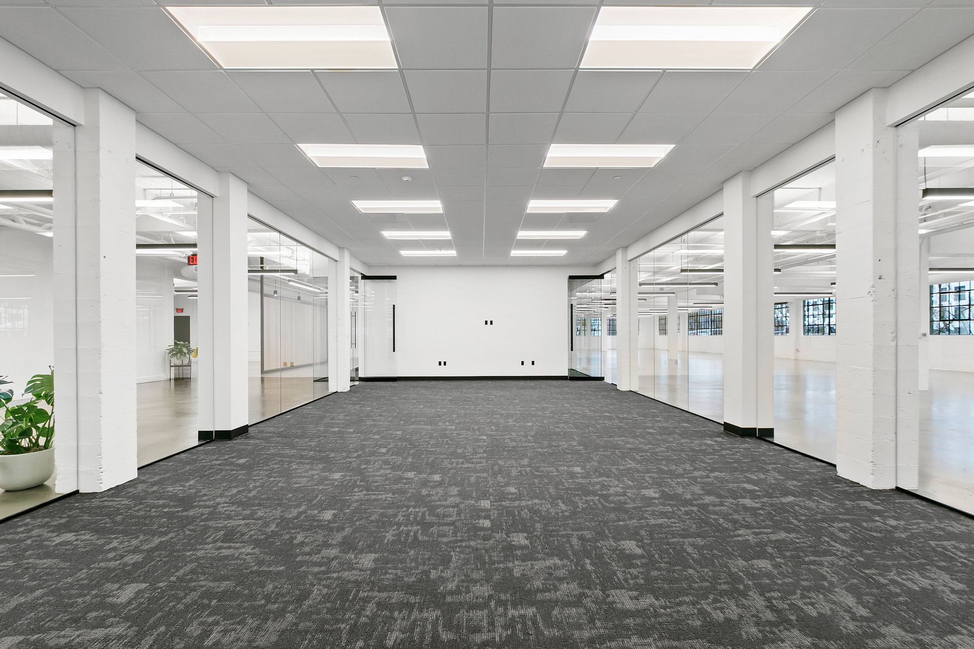 An empty conference room of a commercial business with bright overhead lighting on