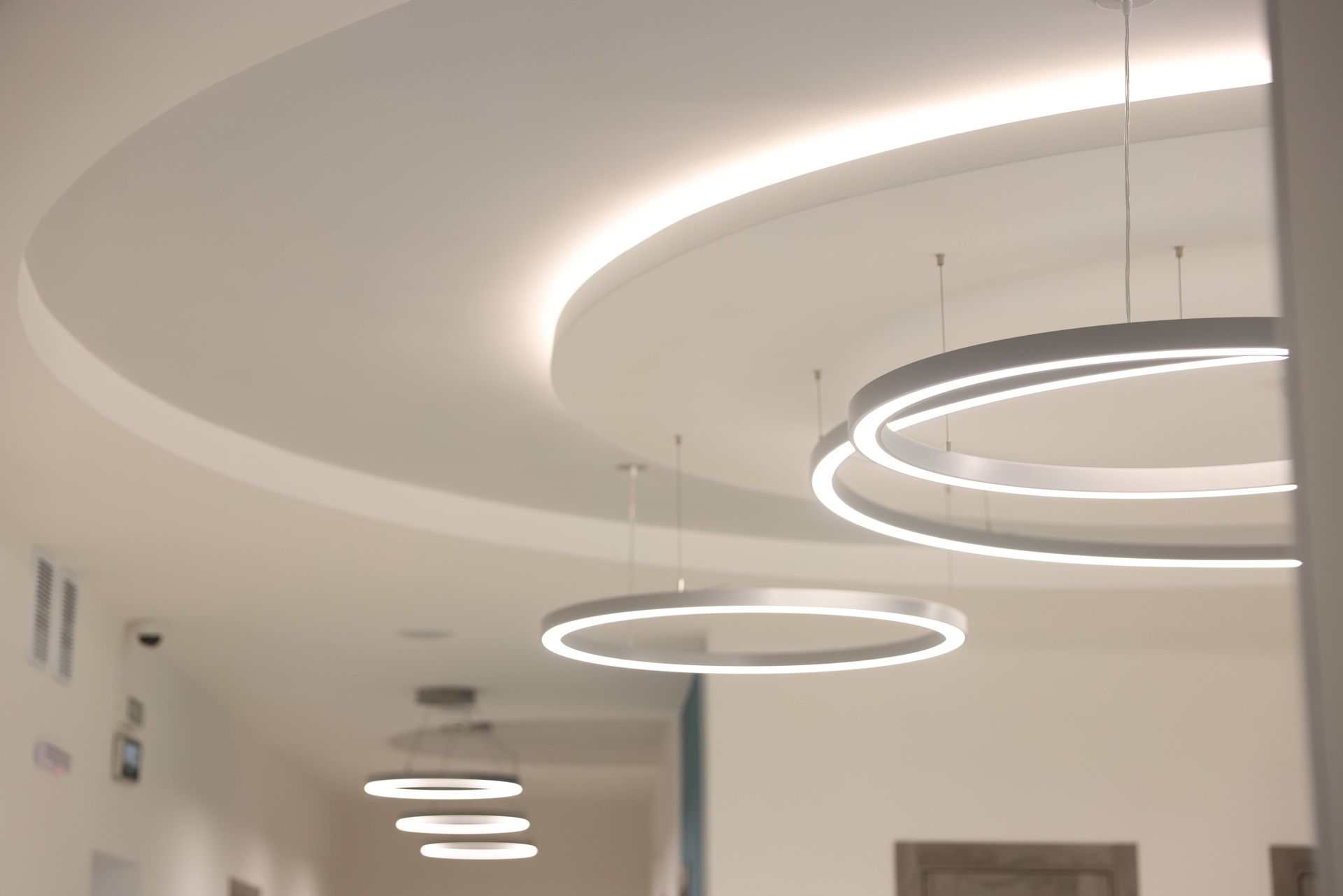 Stylish LED light fixtures, properly installed by an electrician, in a property's ceiling