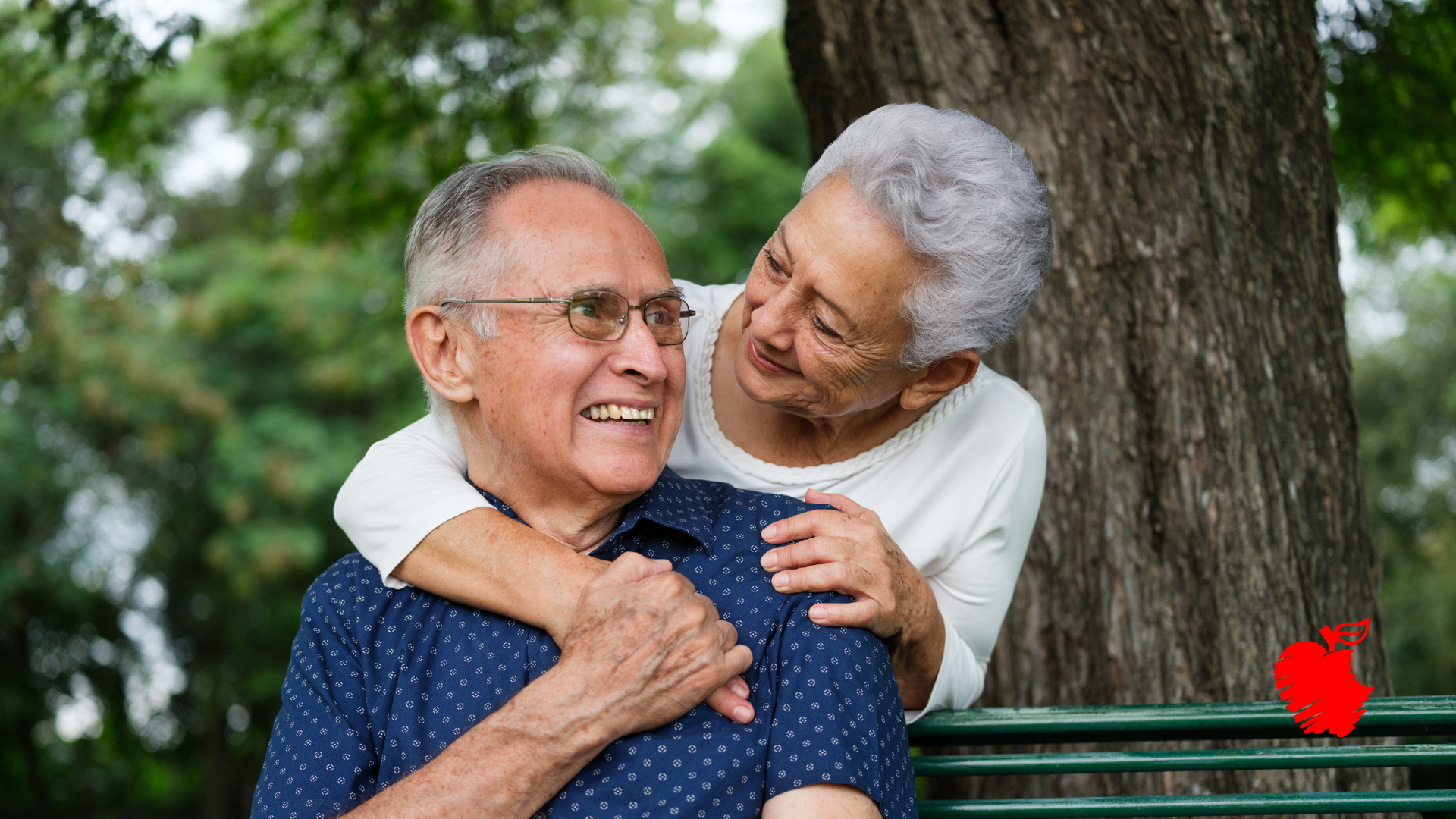 A woman is holding a broken denture in her hand
