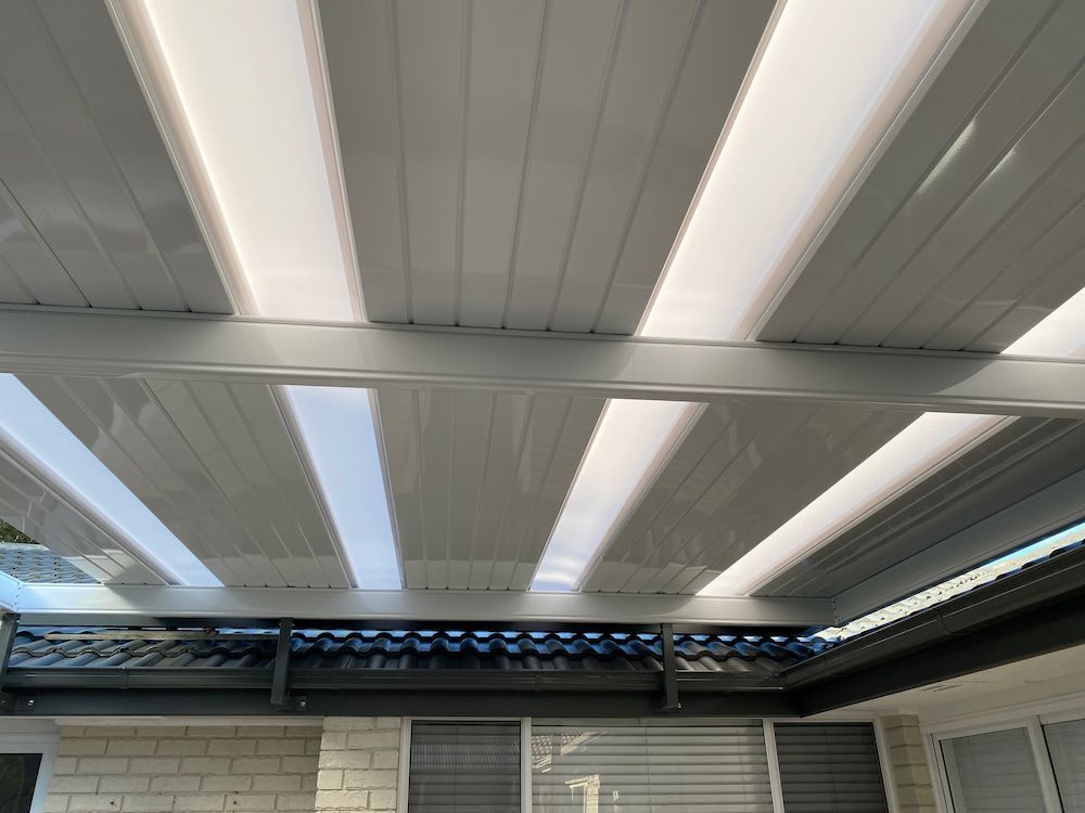The Ceiling Of A House With A Lot Of Lights On It — Newcastle Patio Covers In Newcastle, NSW