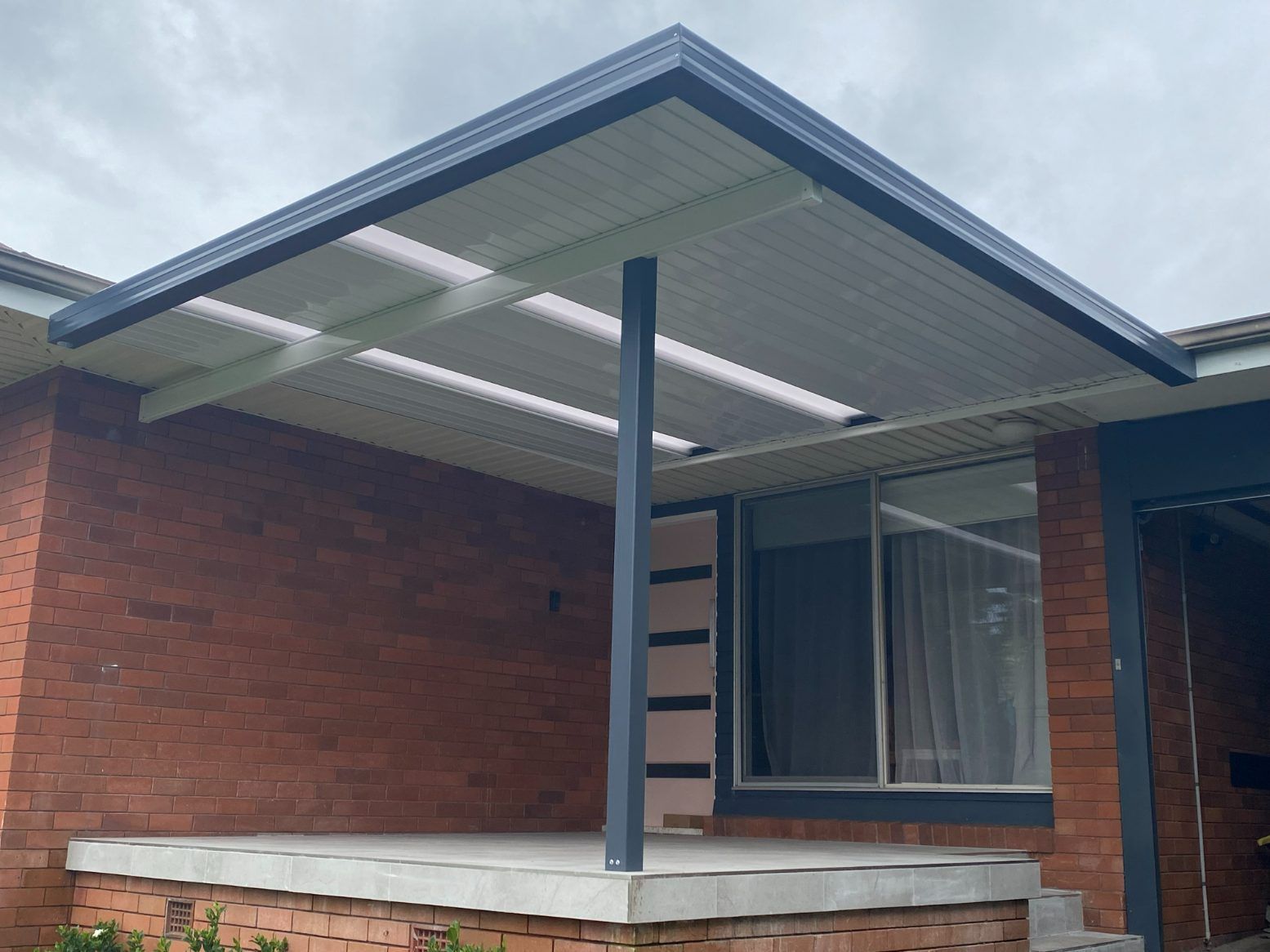 A House With Stairs Leading Up To It — Newcastle Patio Covers In Wallsend, NSW