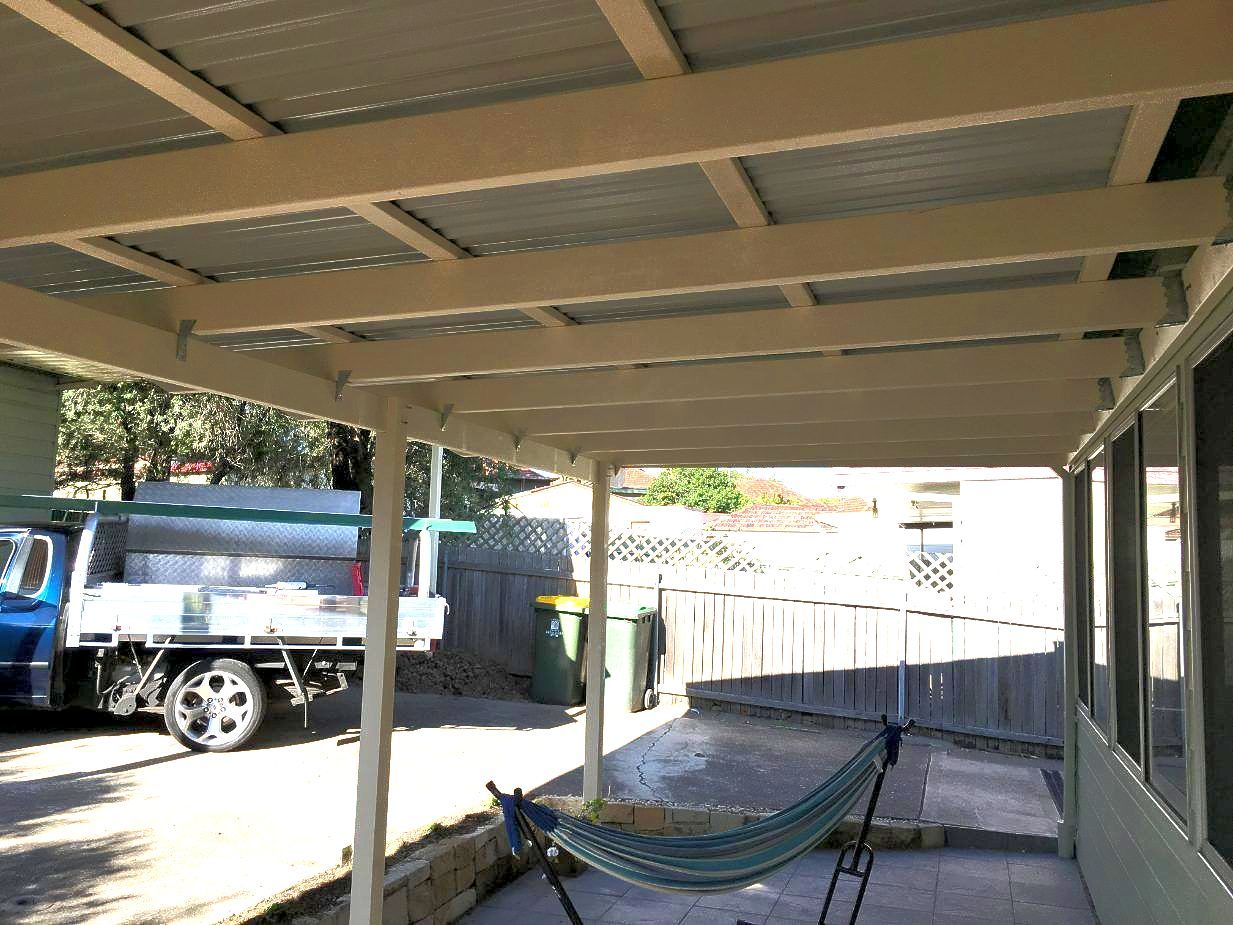 A Patio Cover With Wooden Beams And A Hammock Underneath  — Newcastle Patio Covers In Wallsend, NSW
