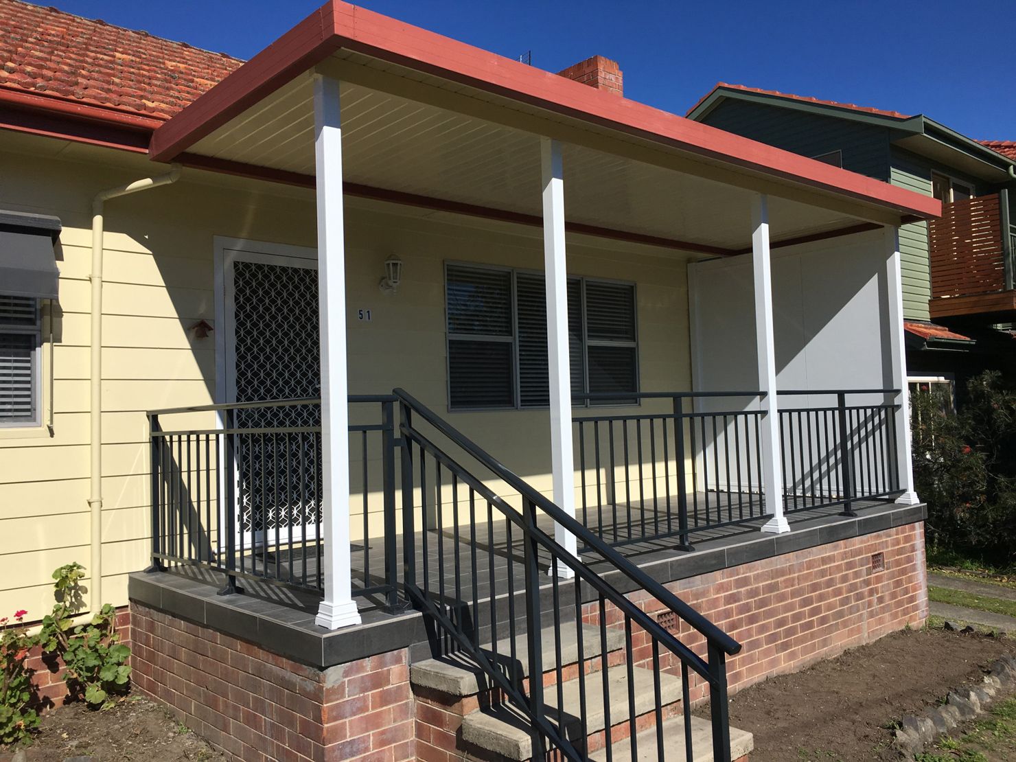 A House With A Verandah With StairsAnd Steel Railing— Newcastle Patio Covers In Wallsend, NSW