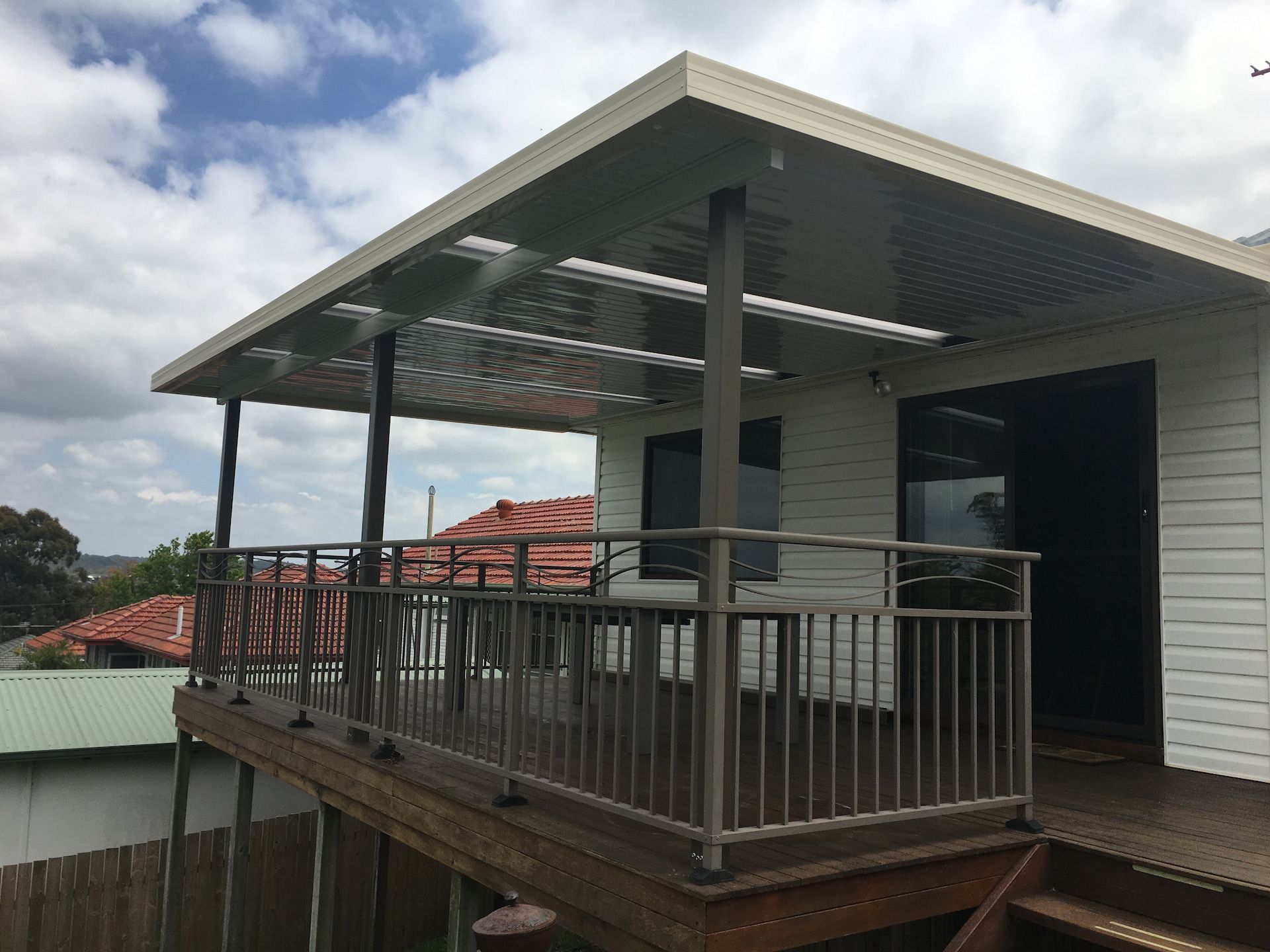 A Patio Cover Above A Deck With Steel Railing  — Newcastle Patio Covers In Wallsend, NSW