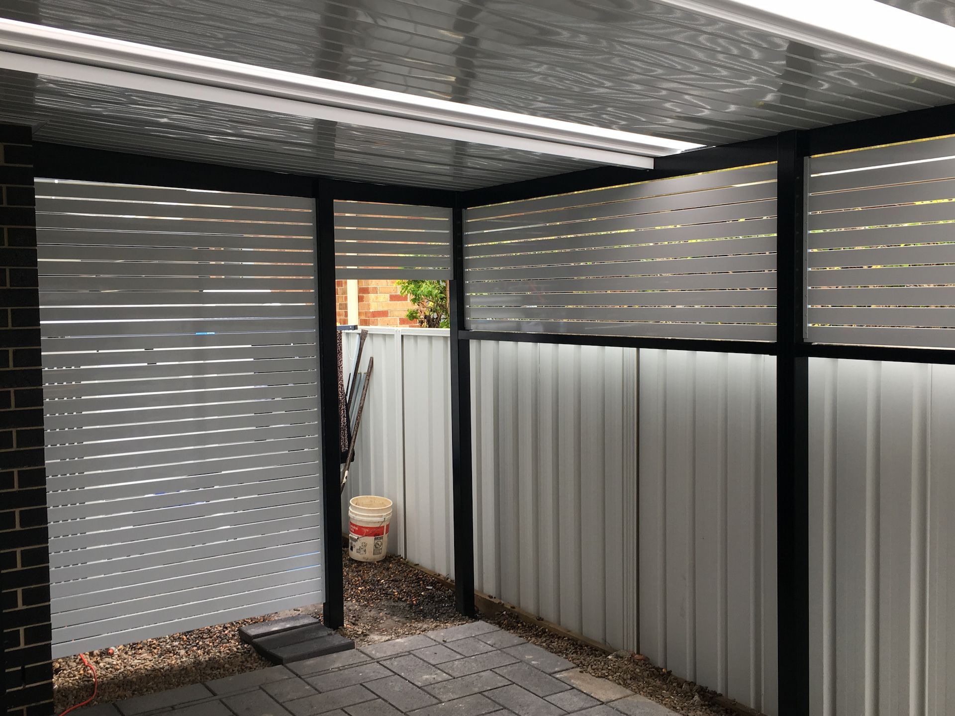 A White Verandah With White Wooden Fencing Underneath It— Newcastle Patio Covers In Wallsend, NSW