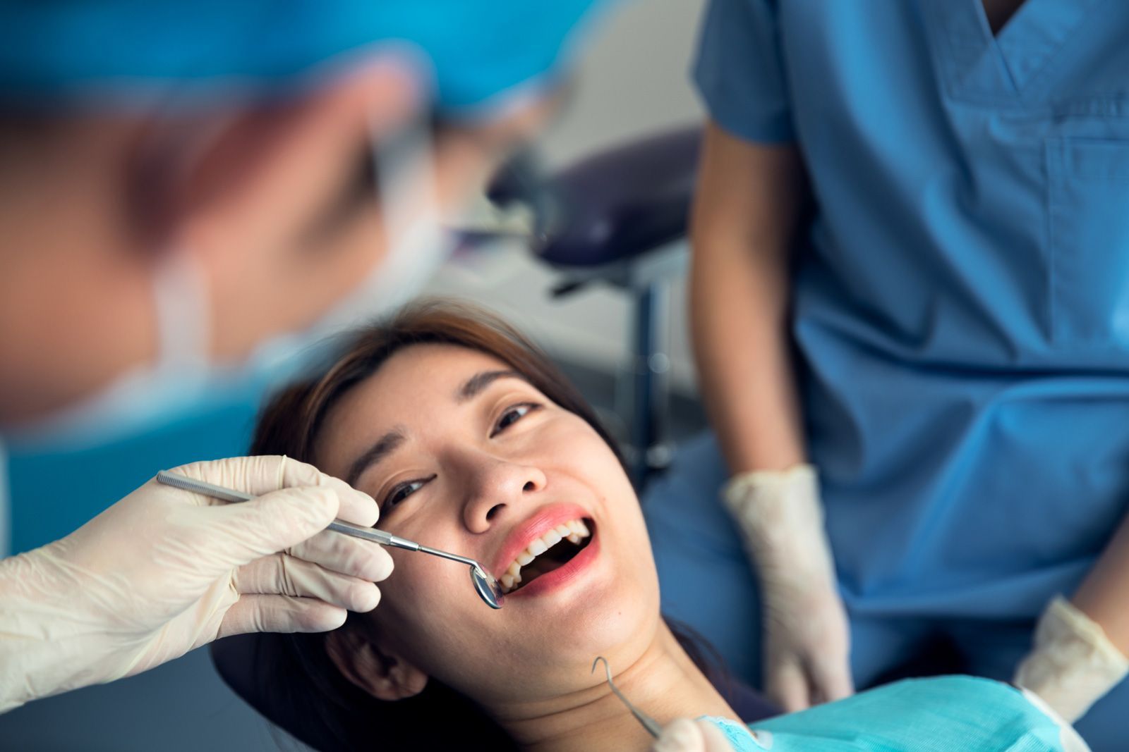 The Dentist Checking The Teeth — Newark, DE — Progressive Dental Arts Christiana The Dentist Checking The Teeth — Newark, DE — Progressive Dental Arts Christiana