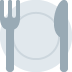 Fork, plate, and knife, set for a meal.