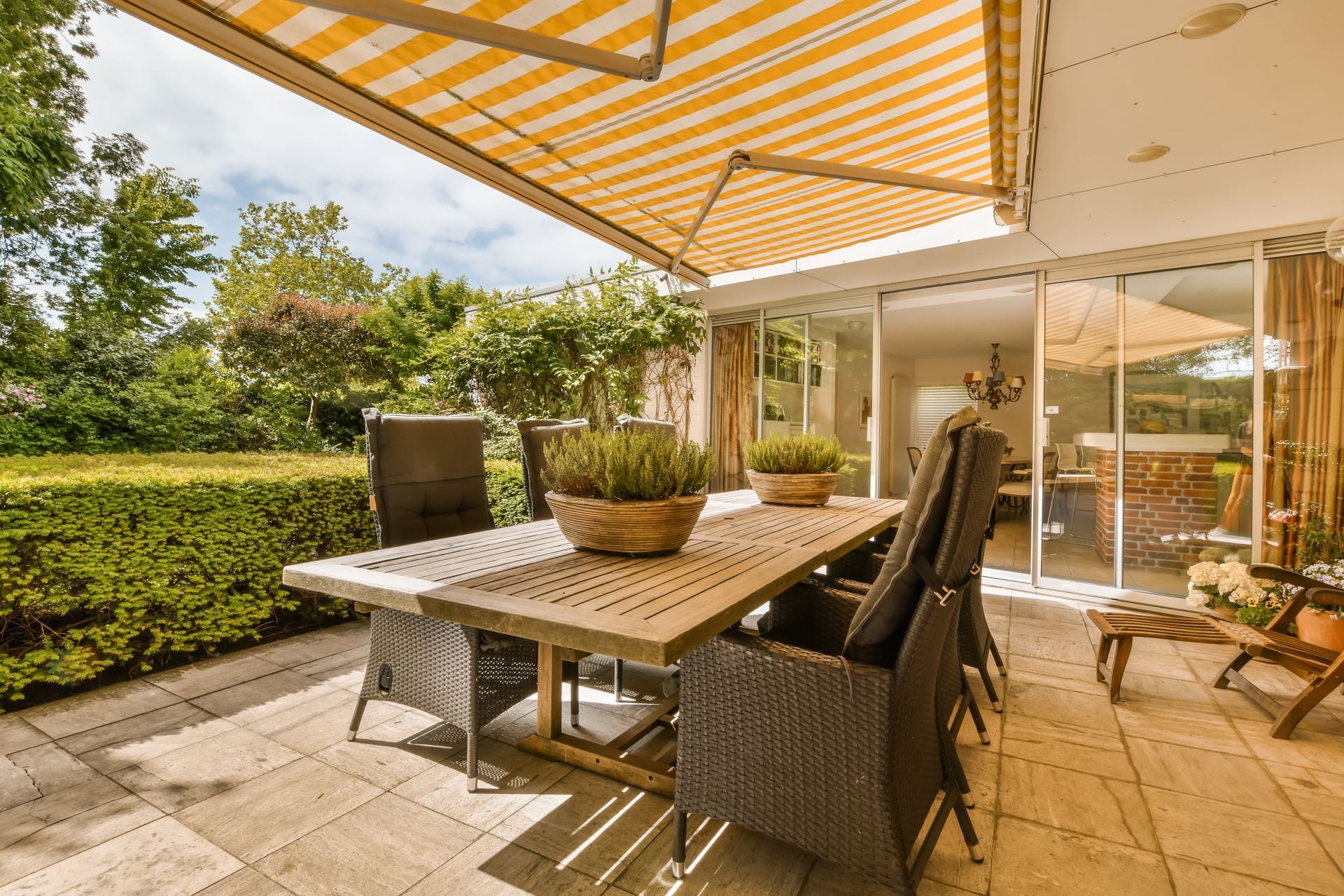 awning protecting patio furniture