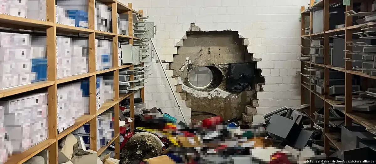 A storage room with shelves filled with boxes, showing a large hole broken through a cinder block back wall. Company Without Sky-Walker A storage room with shelves filled with boxes, showing a large hole broken through a cinder block back wall. Company Without Sky-Walker