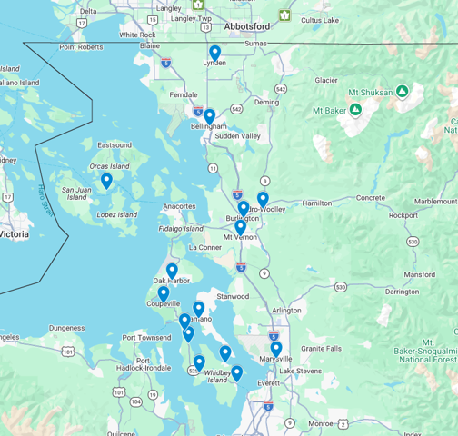 Map with blue location pins clustered along a coastal route and inland roads.