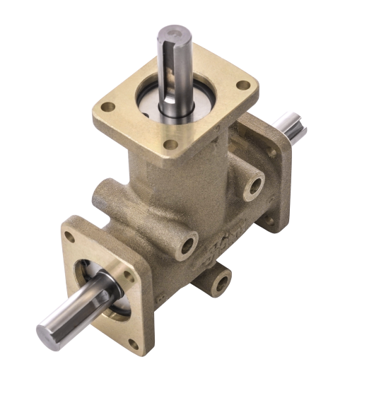 A close up of a brass gearbox on a white background