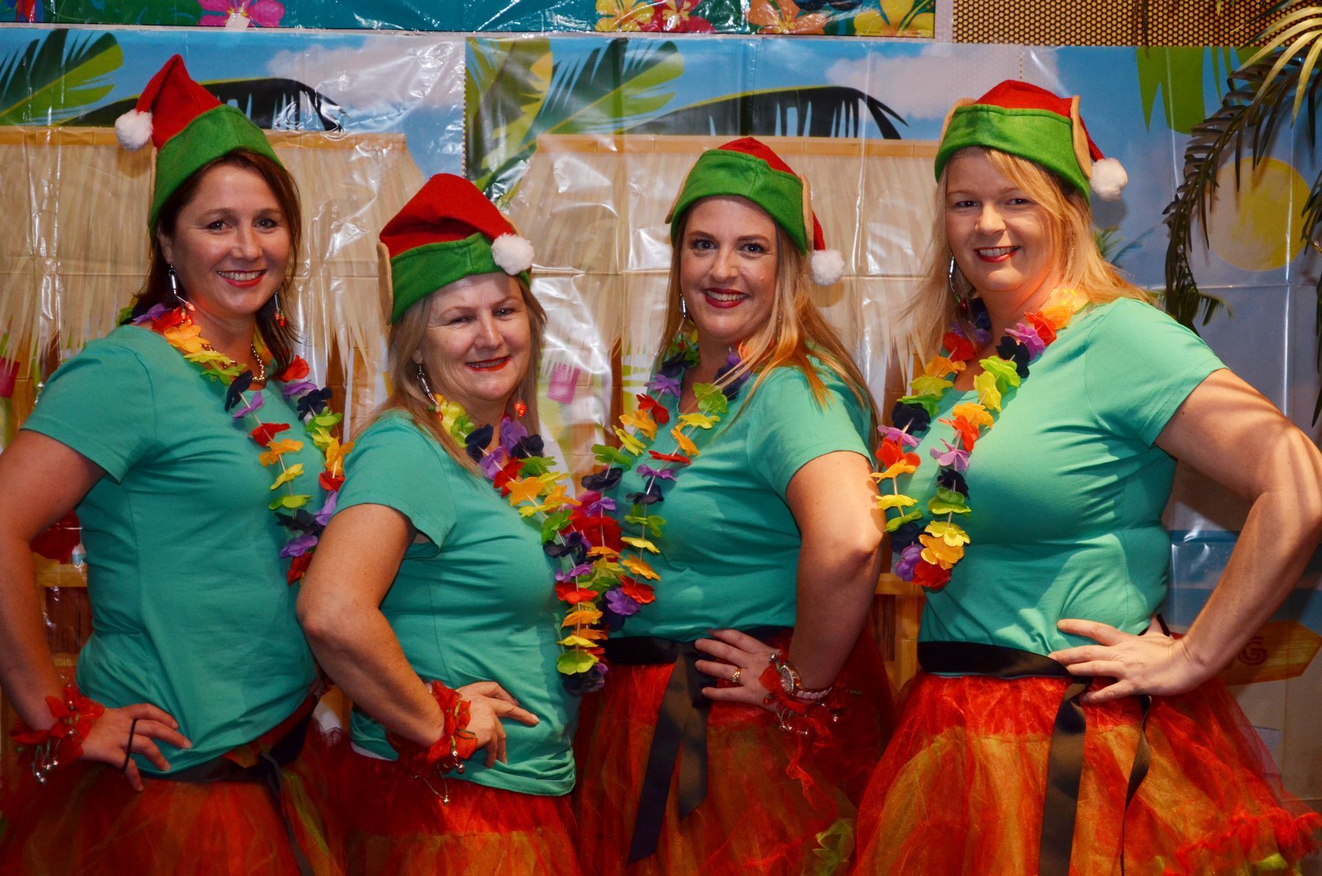 Four People in Green Shirts, Elf Hats — Costumes Galore in Maroochydore, QLD