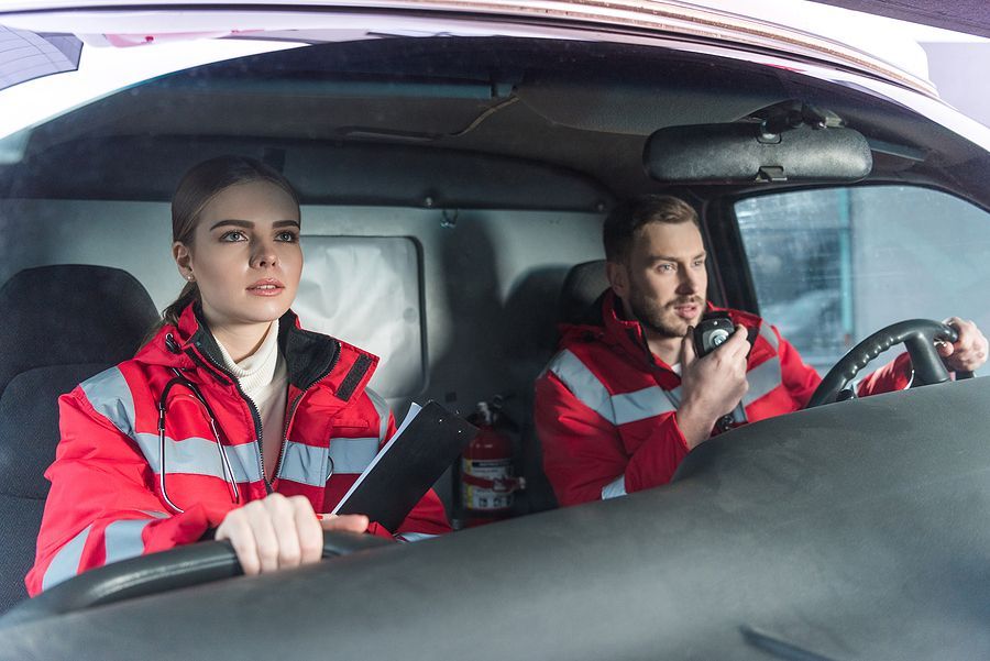 a girl driving a emergency vehicle