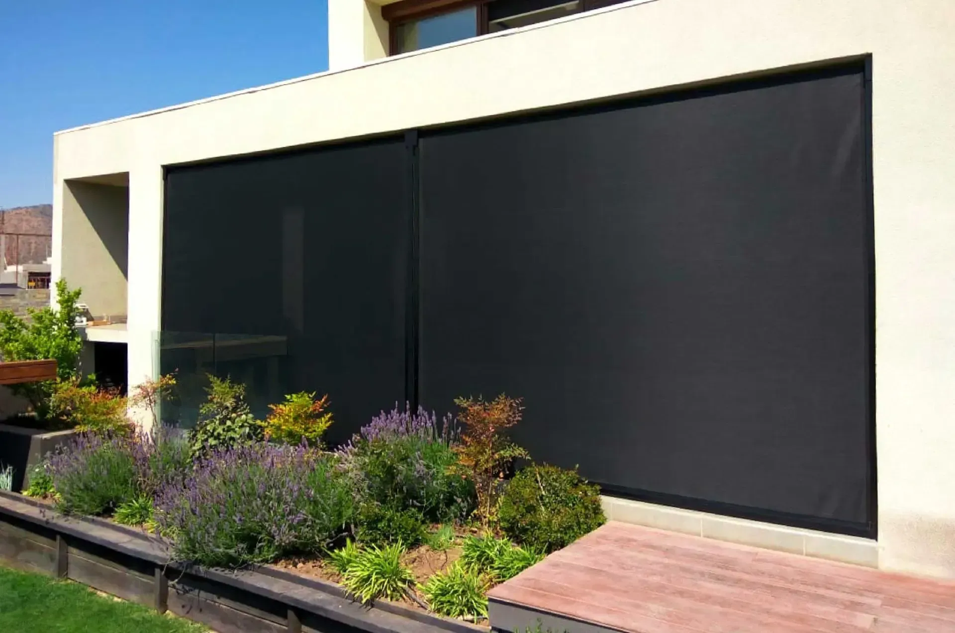 A house with a black screen on the side of it.