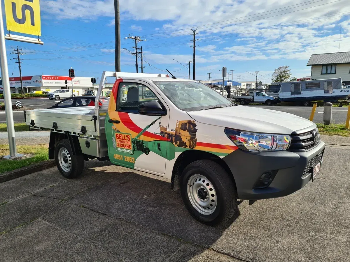 White Toyota Hilux Truck — Bell's Carrying & Crane Hire Service Pty Ltd in Bungalow, QLD