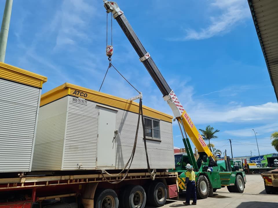Crane Lifting a White and Yellow — Bell's Carrying & Crane Hire Service Pty Ltd in Bungalow, QLD