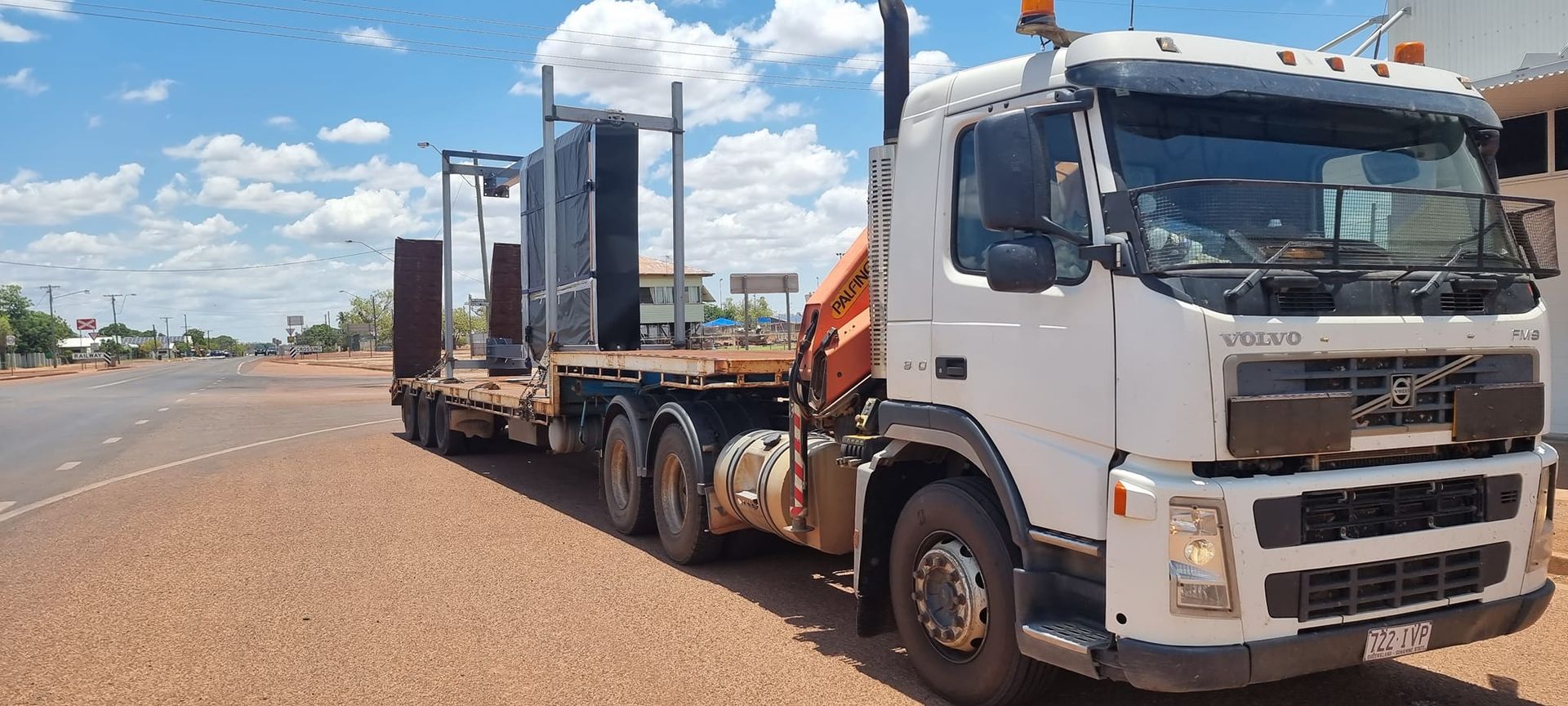 White Volvo Truck Hauling — Bell's Carrying & Crane Hire Service Pty Ltd in Mareeba, QLD