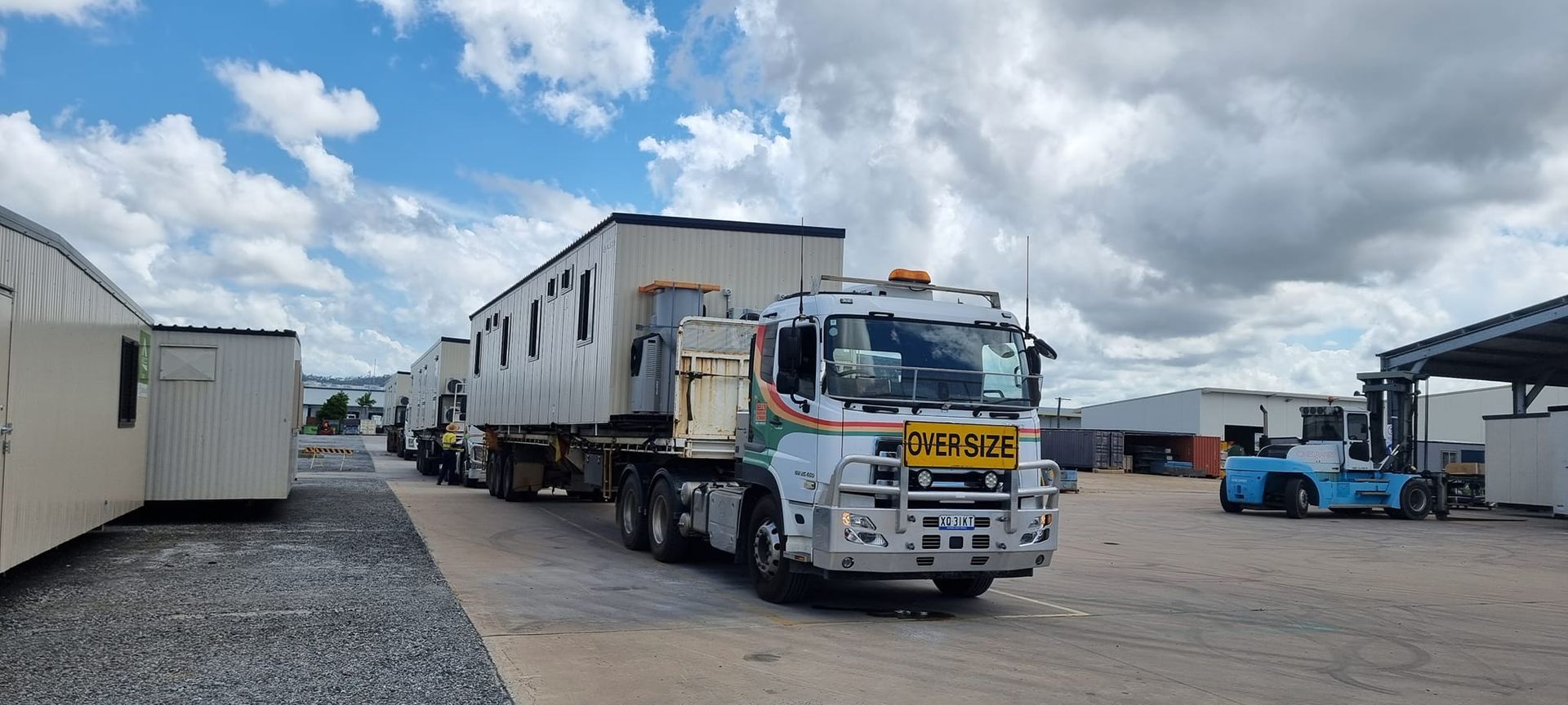 A Truck Transporting Portable Buildings — Bell's Carrying & Crane Hire Service Pty Ltd in Mareeba, QLD