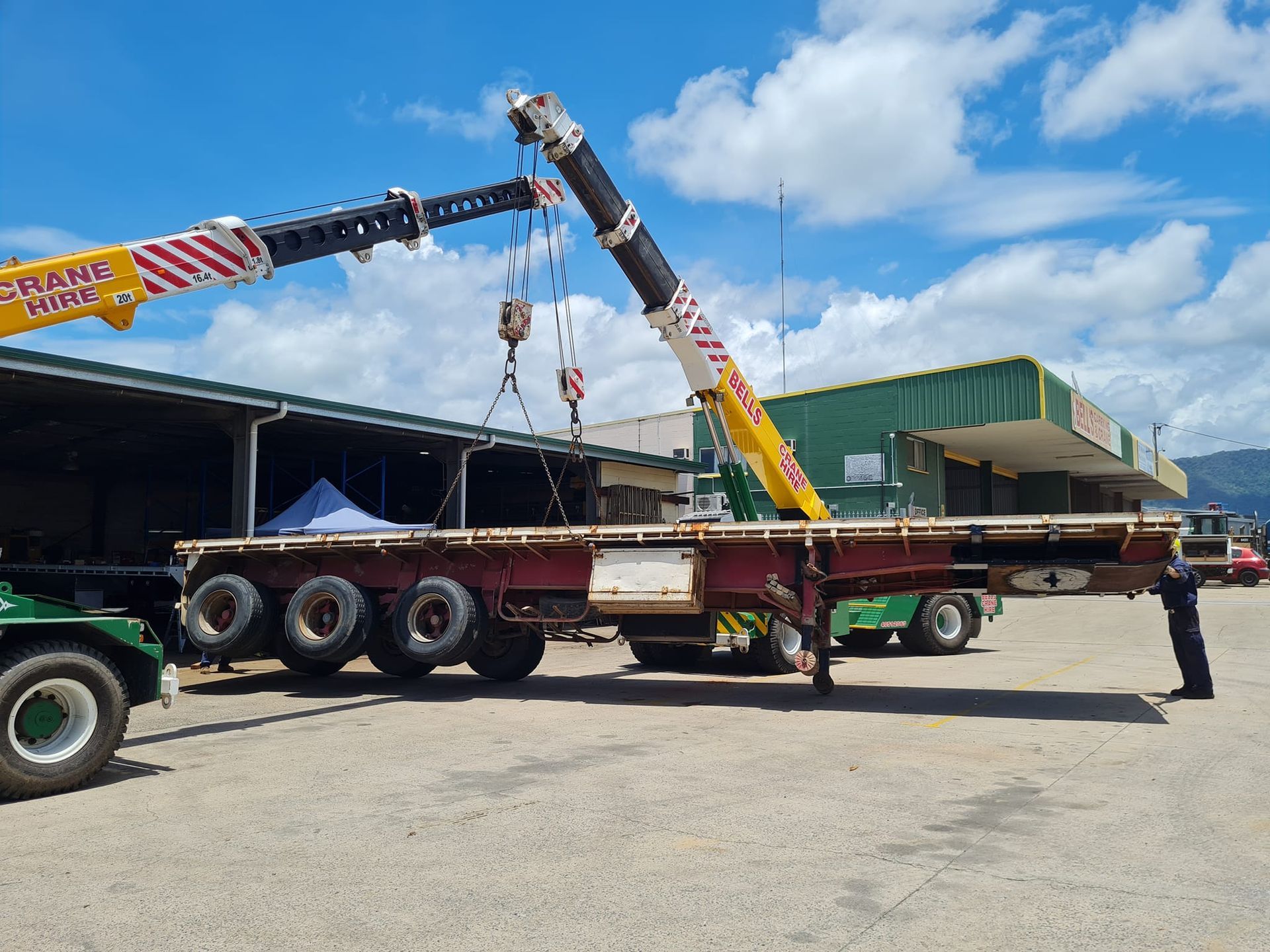 Two Cranes Lift a Flatbed Trailer — Bell's Carrying & Crane Hire Service Pty Ltd in Innisfail, QLD