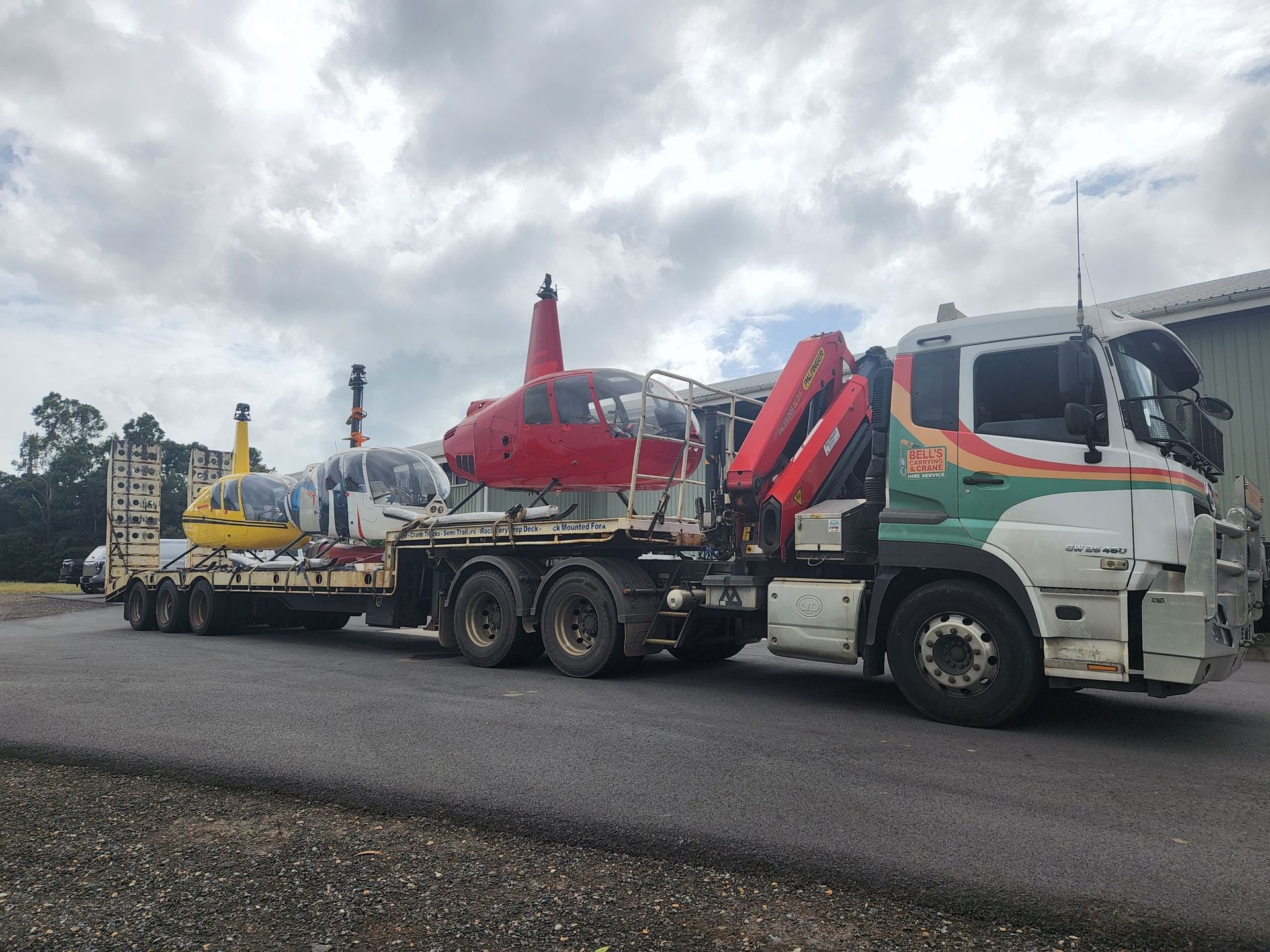 Truck Transporting Helicopter — Bell's Carrying & Crane Hire Service Pty Ltd in Bungalow, QLD