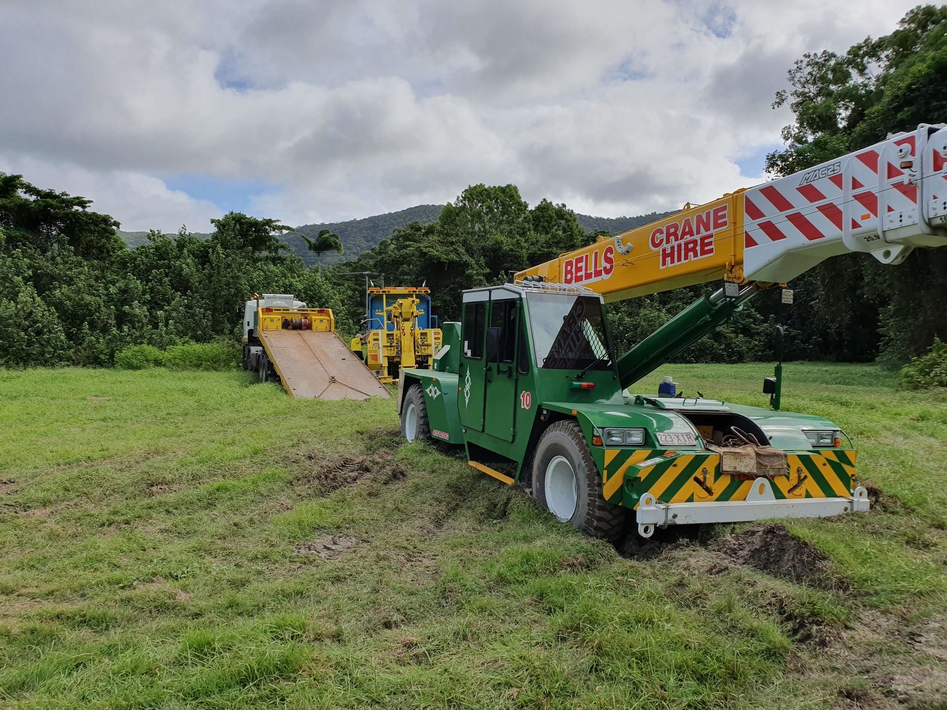 A Green Crane Stuck — Bell's Carrying & Crane Hire Service Pty Ltd in Normanton, QLD