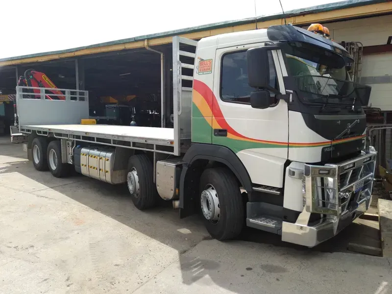 Flatbed Volvo Truck — Bell's Carrying & Crane Hire Service Pty Ltd in Bungalow, QLD
