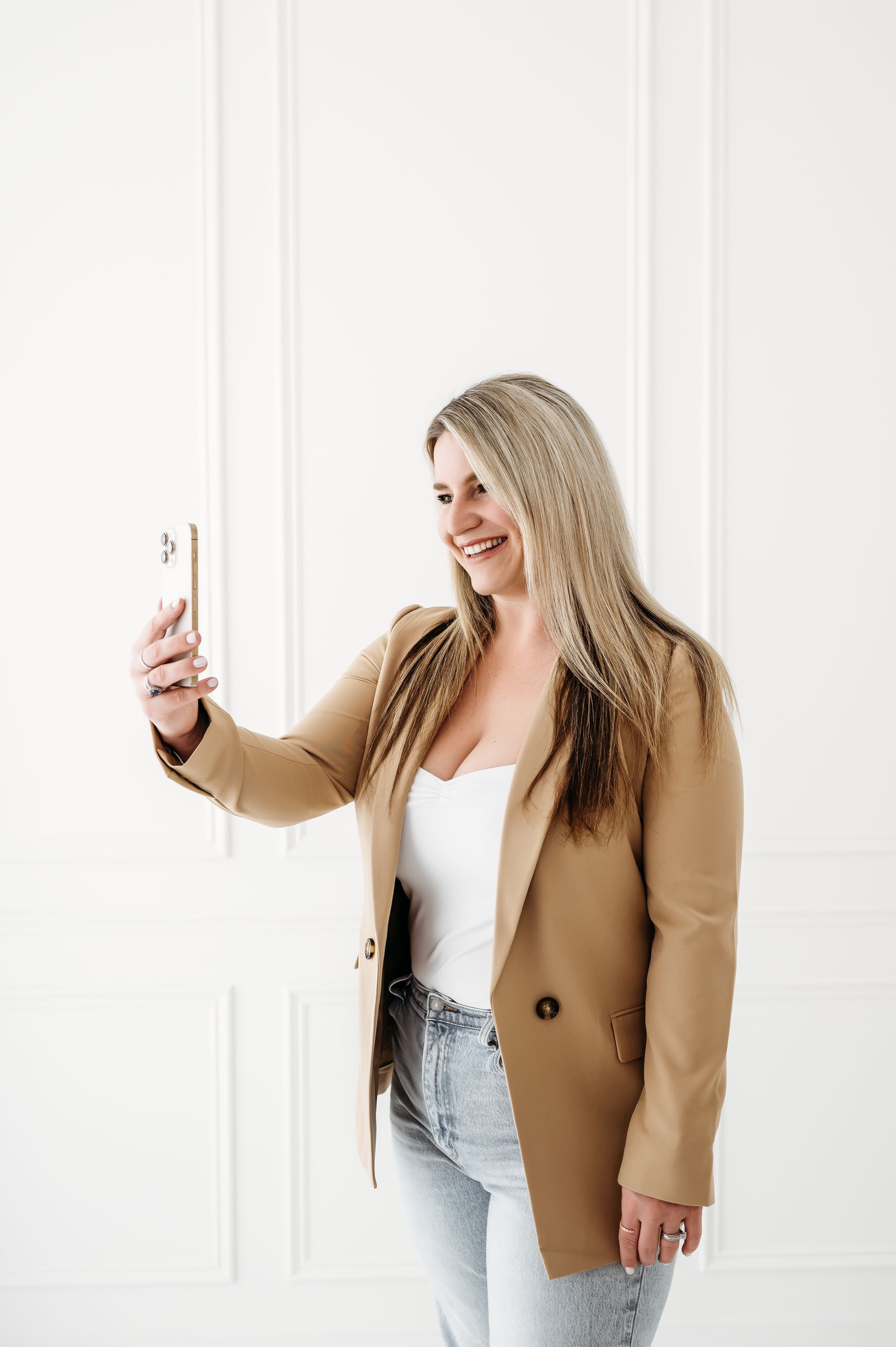 social media marketing manager looking at cellphone