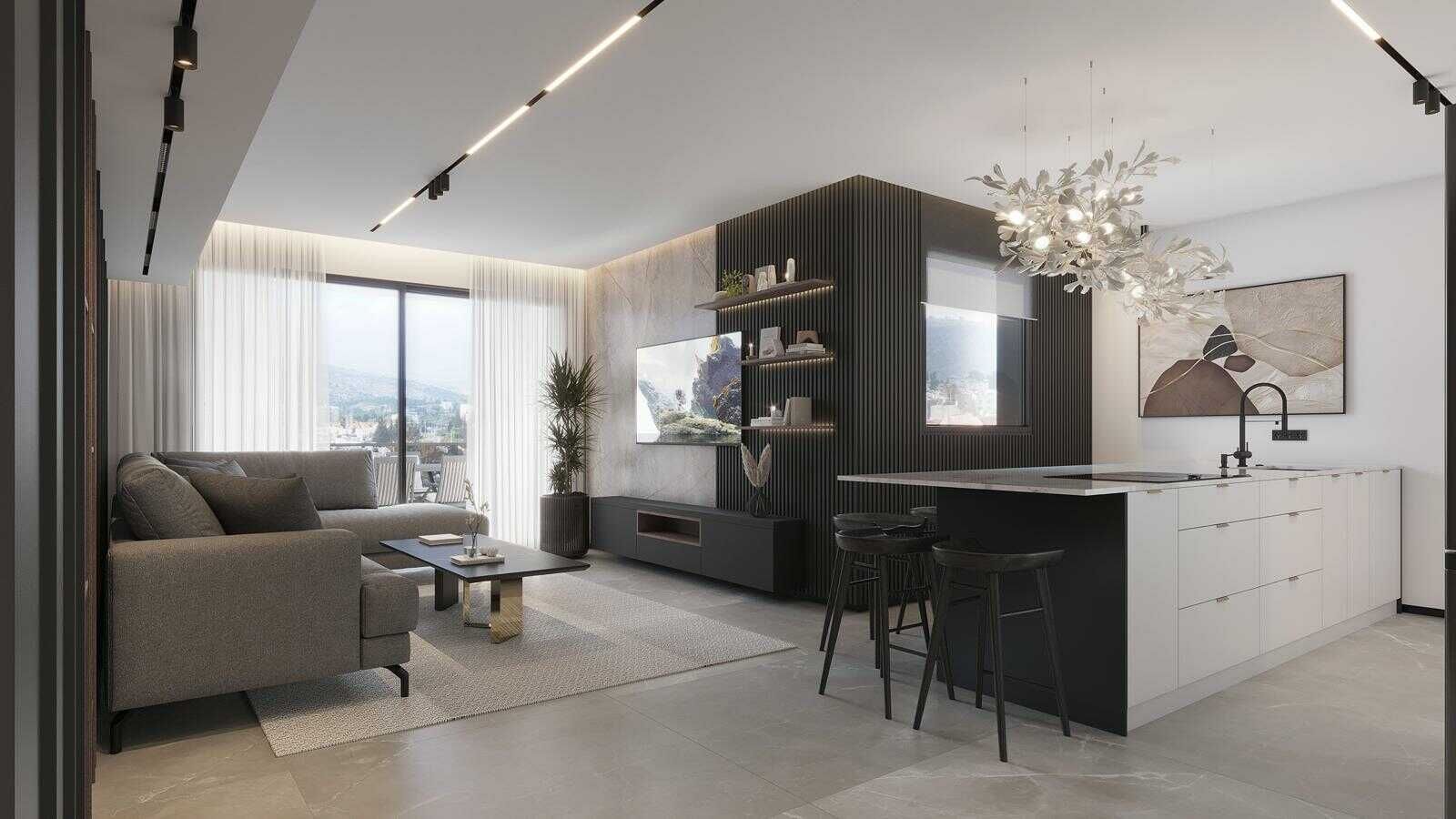 עיצוב חלל מגורים פתוח המשלב סלון מודרני עם ספה אפורה וקיר טלוויזיה מחורץ, לצד אי מטבח שחור - חבילת ייעוץ לעיצוב הבית, שמרית אוחיון.