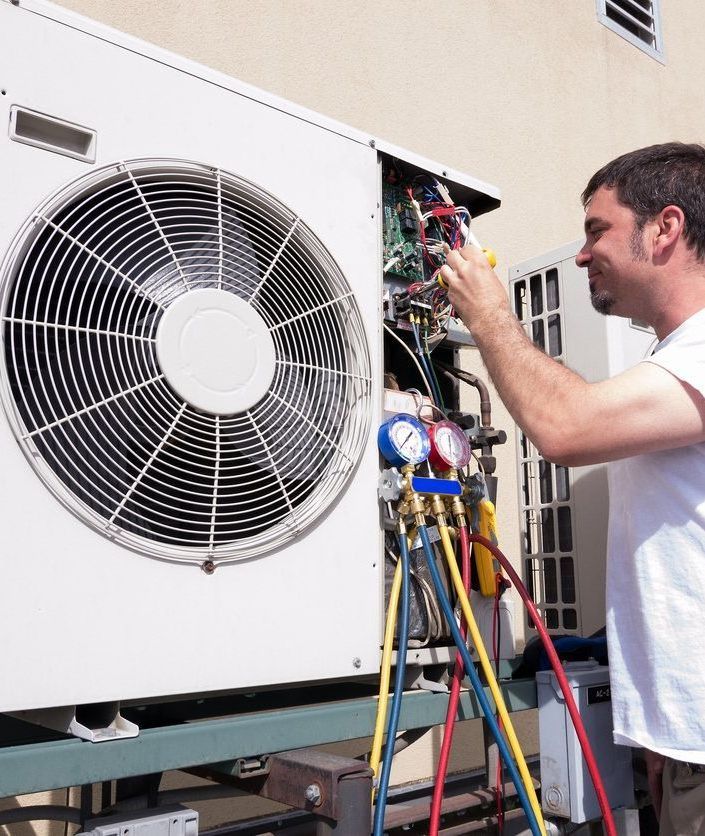 Technicians Working on HVAC Unit