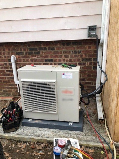 hvac unit being serviced outside