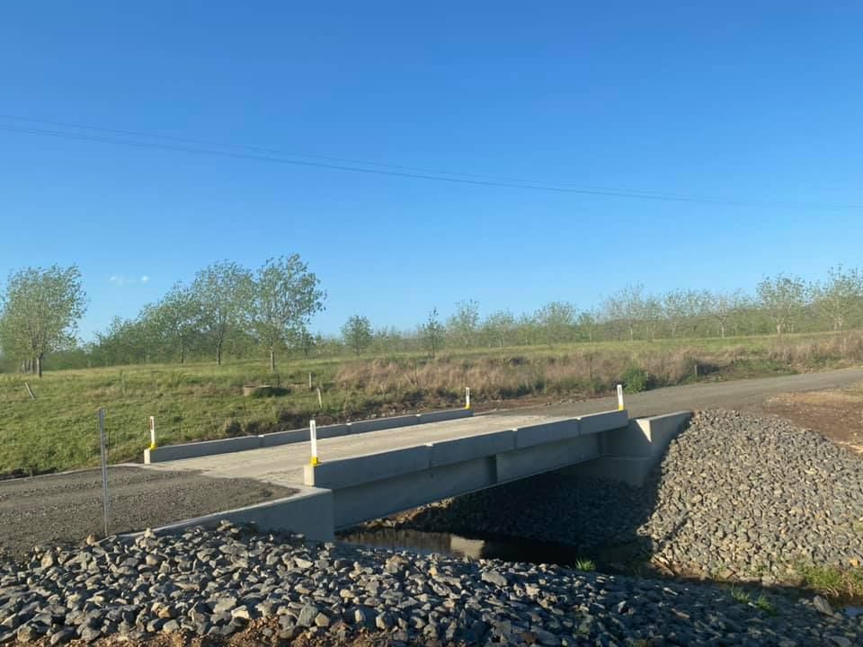 A Concrete Bridge Over a Stream in the Middle of a Field — Graham's Precast Concrete Products Pty Ltd in Kyogle, NSW