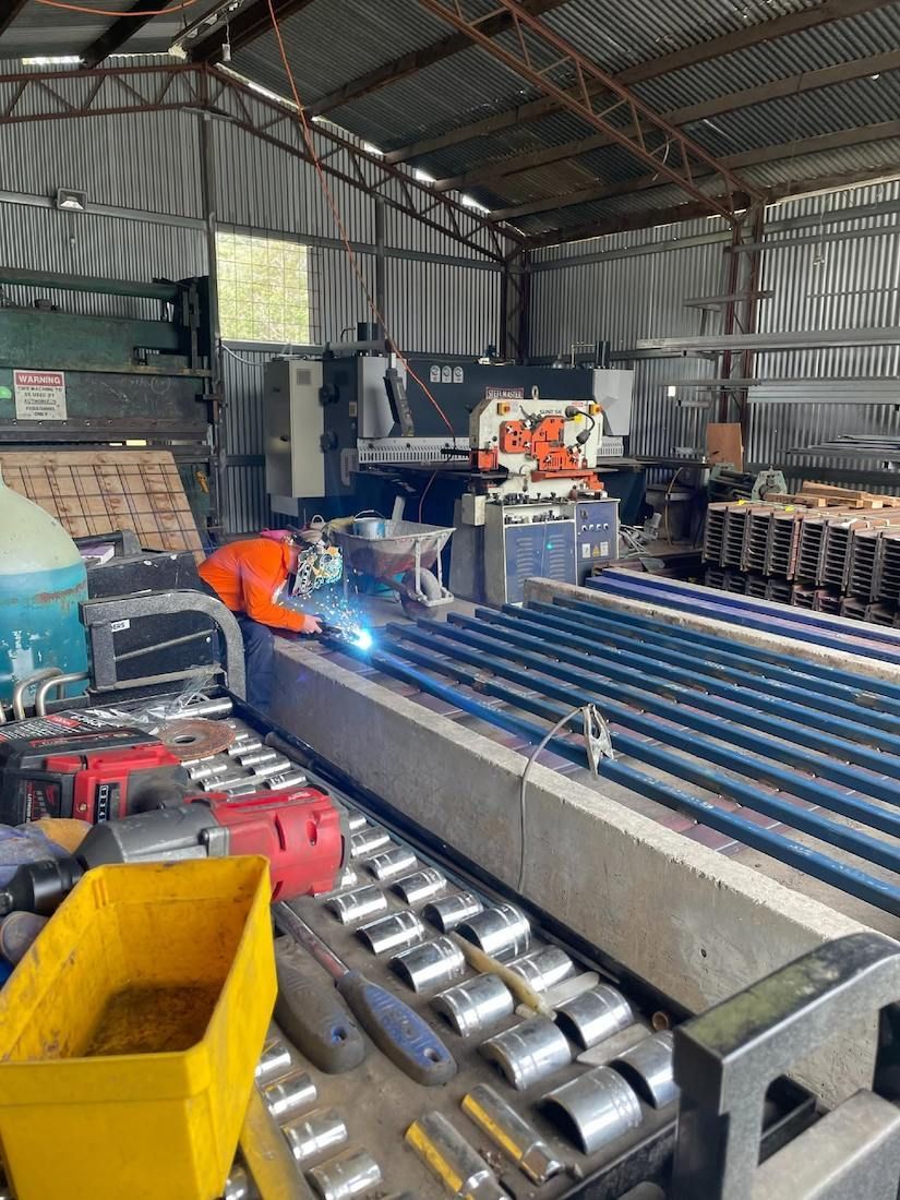 Worker Welding Metal Framework For Concrete Water Troughs In QLD