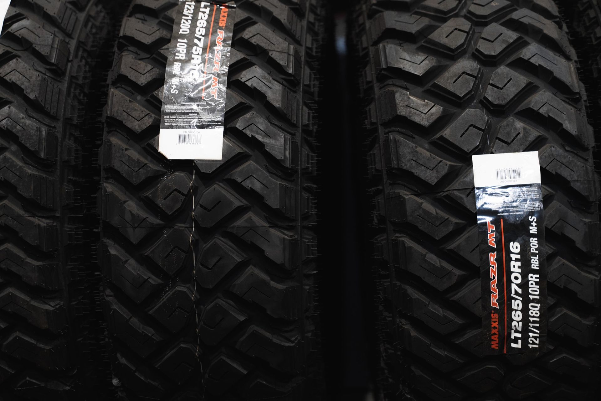 Two Black Off-Road Tires with Labels, Shown Side by Side — Gardiner Automotive & Performance in Branxton, NSW