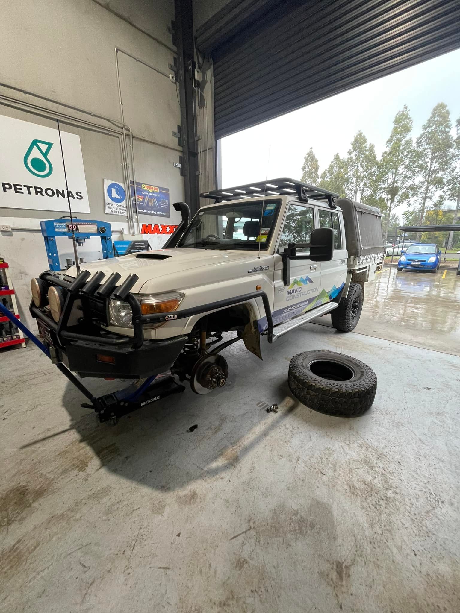 Damaged Off-Road Vehicle in A Garage, Missing Front Wheel — Gardiner Automotive & Performance in Rutherford, NSW