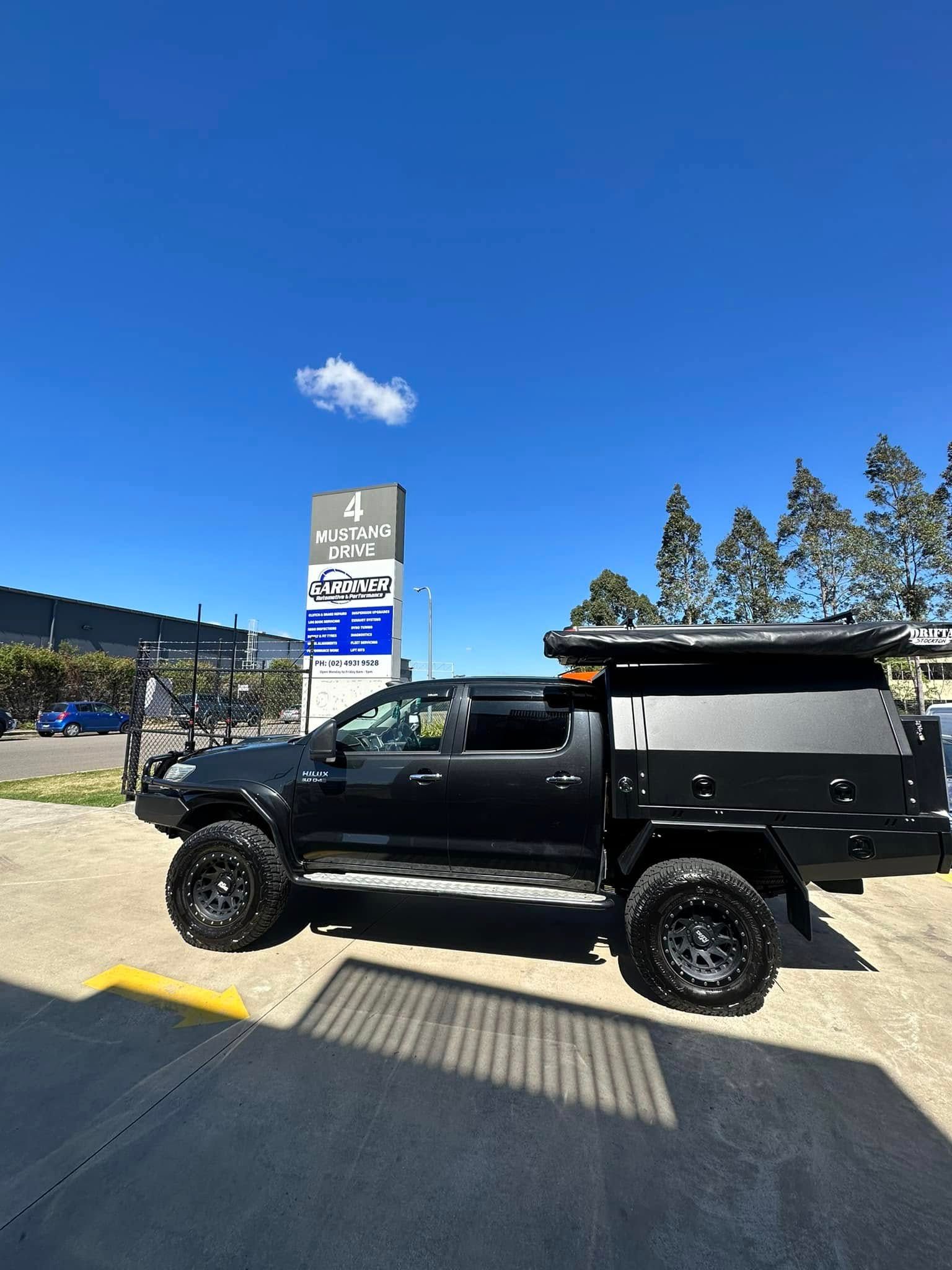Black Pickup Truck with Camper Shell — Gardiner Automotive & Performance in Rutherford, NSW