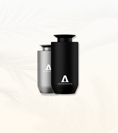 Two bottles of shampoo are sitting next to each other on a white surface.