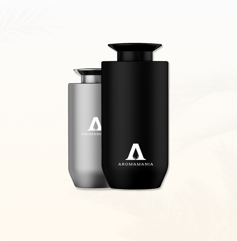 Two bottles of perfume are sitting next to each other on a white background.