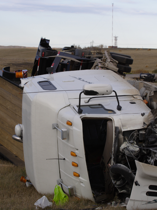 two firefighters are working on a car crash