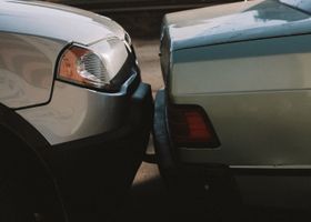 Two cars after a rear-end collision on a Northwest Indiana road