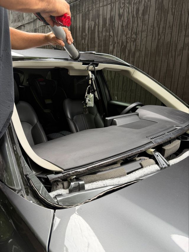 Ocean Glass technician preparing a 2024 Mazda CX-90 windshield opening for replacement