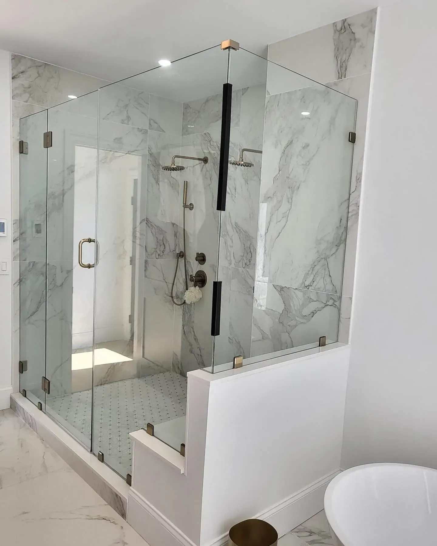 Full-height frameless shower enclosure with clear glass
