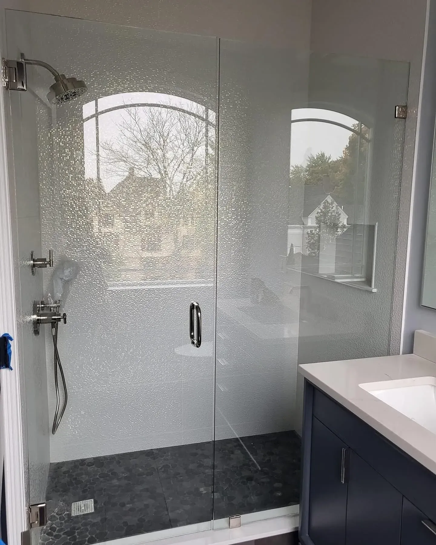 Shower glass hardware and door alignment detail