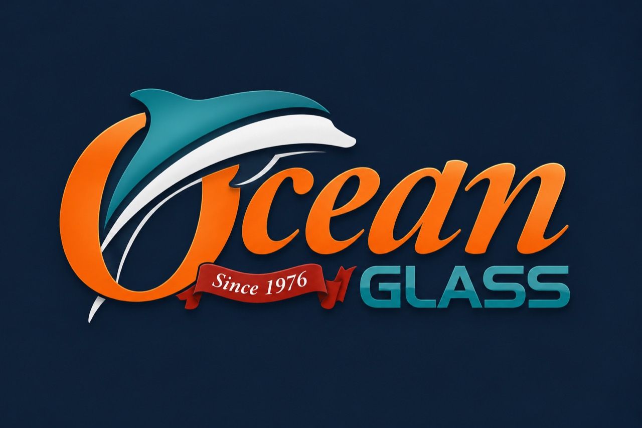 Ocean Glass logo with orange and teal dolphin over blue background, “Since 1976” text