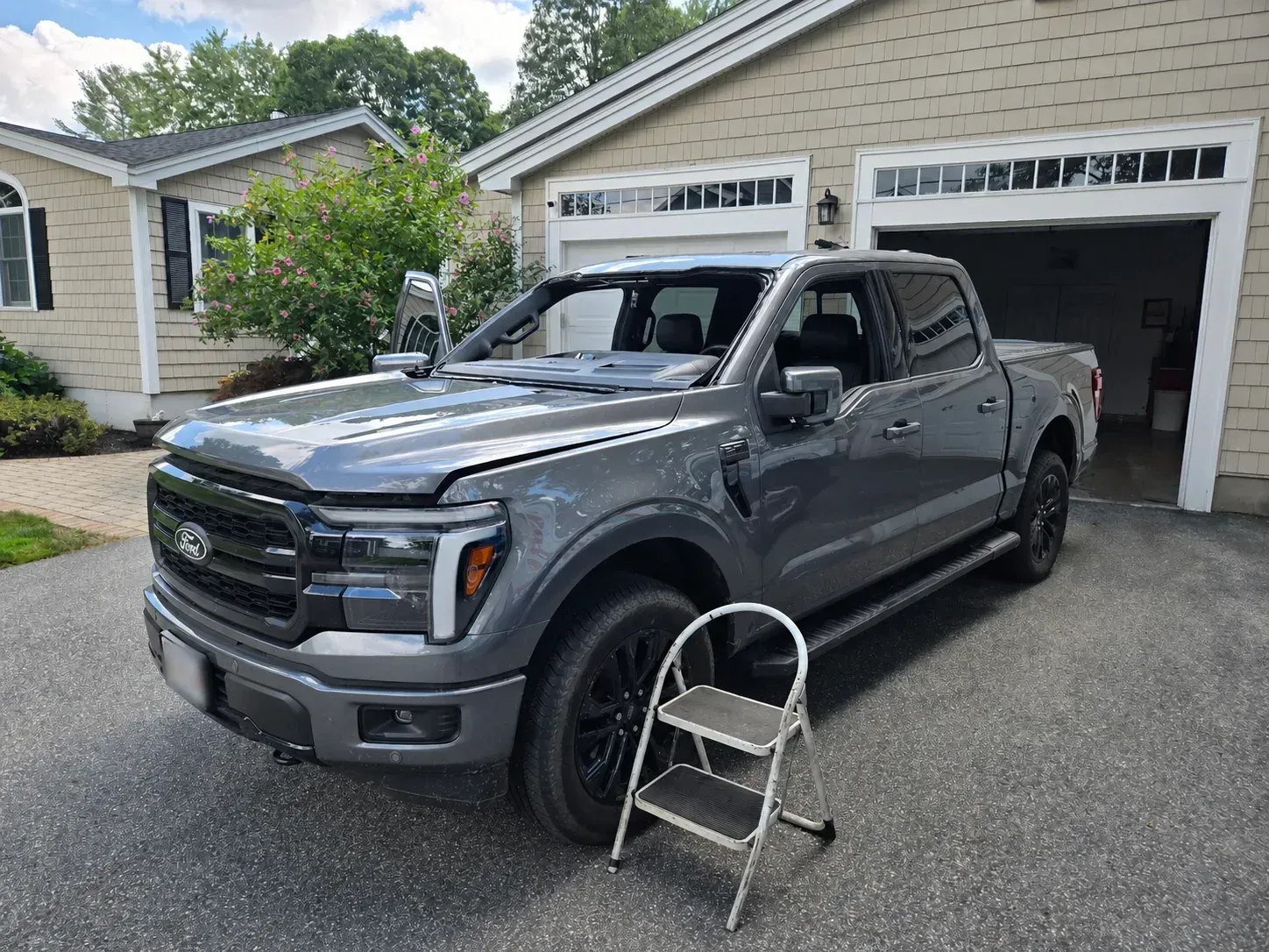 Ford pickup prepared for windshield removal during auto glass service